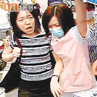 診所女護士在旁攔住扁女（左）。	電視圖片