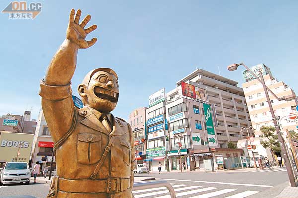 JR龜有站北口的勘吉銅像，當年由首相揭幕。