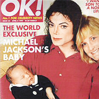 MJ手抱大仔王子米高與第二任老婆黛比登上英國雜誌《OK!》封面。	資料圖片