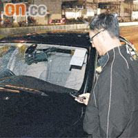 南昌街<br>私家車擋風玻璃損毀，司機在車旁助查。