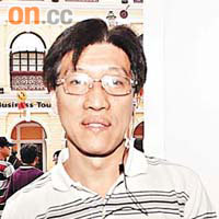 區錦新